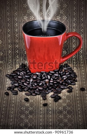 Grungy red ceramic cup or mug filled with steam hot black coffee with beans over vintage brown wallpaper, hdr treatment.