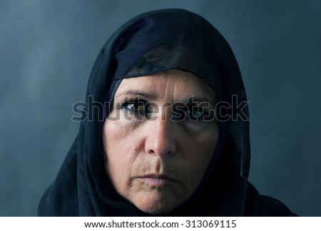 Similar – Image, Stock Photo Portrait of a Muslim woman in traditional cloth in front of wooden door frame