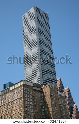 Tall Houston Building against Blue Sky and other architecture(Release Information: Editorial Use Only. Use of this image in advertising or for promotional purposes is prohibited.)