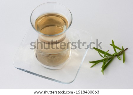 Rosemary tea in Armudu glass with branch of rosemary on the white table as background Photo stock © 