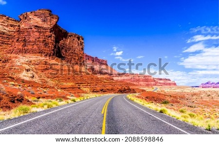 Road in the desert of the red canyon. Red rock canyon highway road landscape. Highway road in canyon desert. Canyon road landscape