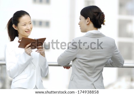 Japanese Business Woman resting on the roof