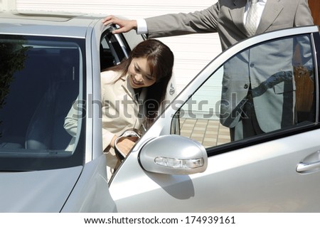 Japanese Lady getting into a car