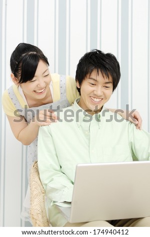 Japanese Couple looking at the personal computer