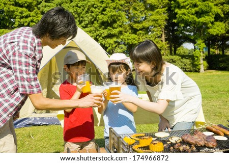 Japanese Family drinking the toast in the barbecue party