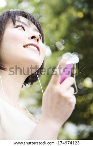 Japanese Woman listening to music