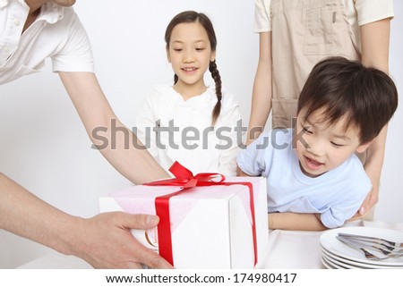 Japanese boy is happy for a box of cake