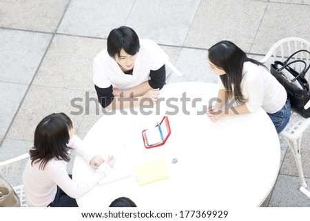 Japanese Students sitting around a table