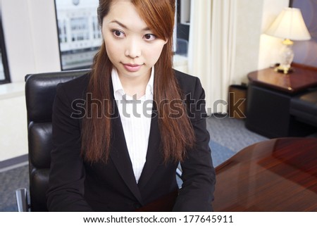 Japanese Office Lady working on a computer