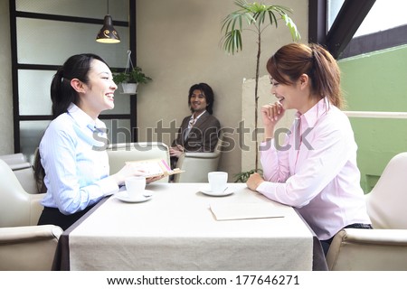 Japanese Office Lady talking in a cafe