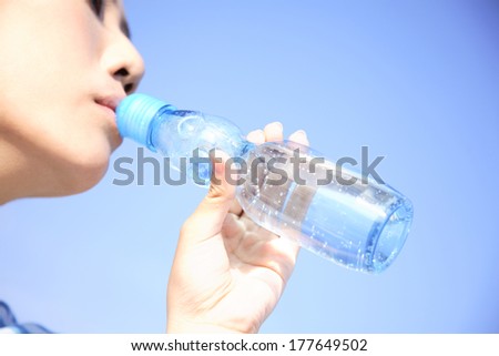 Japanese woman drinking lemonade