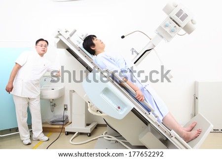Japanese Technician explaining X-ray to patient