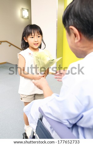 Japanese girl visiting grandfather in the hospital