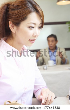 Japanese woman in the meeting in a cafe