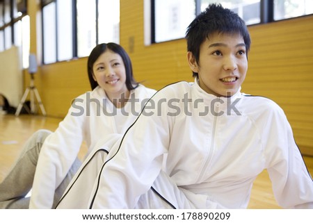 Japanese men and Japanese woman stretching out