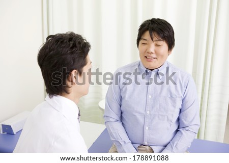 Obese Japanese man meets with doctor