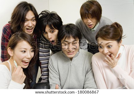 Japanese students reviewing something on the computer