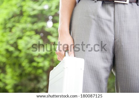 Hand of business Japanese man with attache case