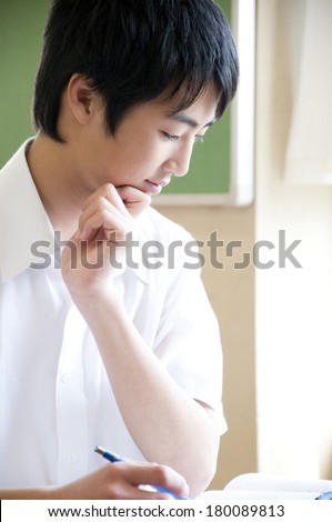 Junior high-Japanese boy listening to the lecture in the class