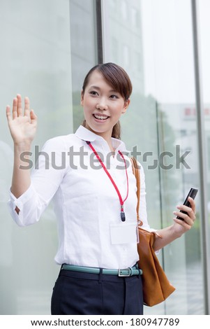 A thrilled Japanese office lady who just bought a smart phone