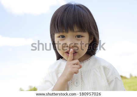 Japanese girls making a index finger in front of mouth