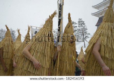 Kasedori (straw bird) festival-goers in elaborate costumes, Japan