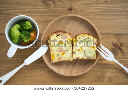 A quiche-like cake and a cup of vegetables