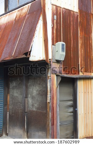 Deserted house with roof built from corrugated metal