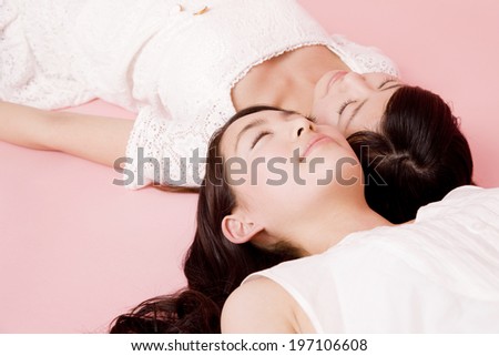 Two Women That Has Been Lying On His Back