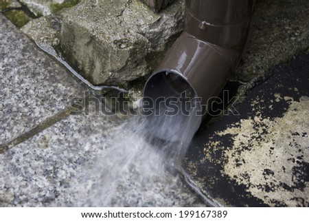 Rain Gutter With A Large Amount Of Rainwater Due To Heavy Rain