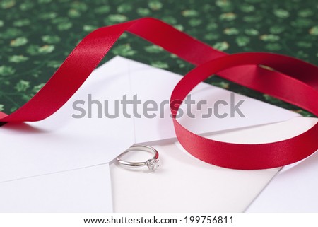 Red Ribbon And The Diamond Ring For Christmas Gift