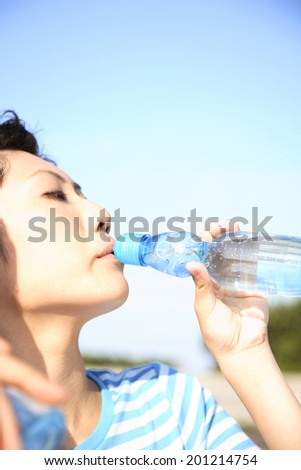Woman drinking lemonade