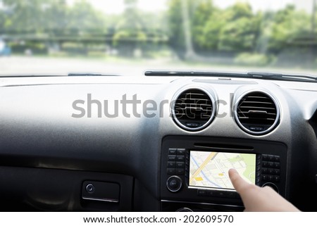 Finger Pointing At The Car Navigation