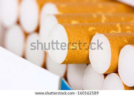 Close-up of cigarette sticking out from the pack