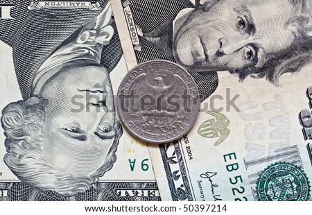 close-up of a USA currency,twenty five cents on dollars background