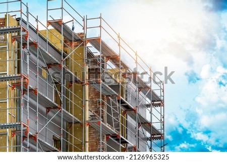 External wall insulation. Energy efficiency house wall renovation for energy saving. Exterior house wall heat insulation with mineral wool, building under construction. Stock foto © 