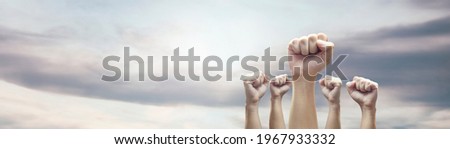 Man hands with clenched fist on sky background expressing freedom Photo stock © 