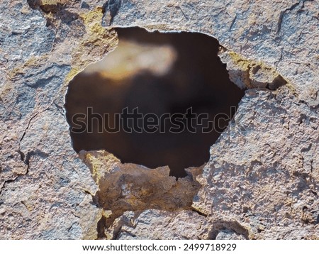 Similar – Image, Stock Photo The rust eats away at the metal plate towards the center. Nothing can stop it.