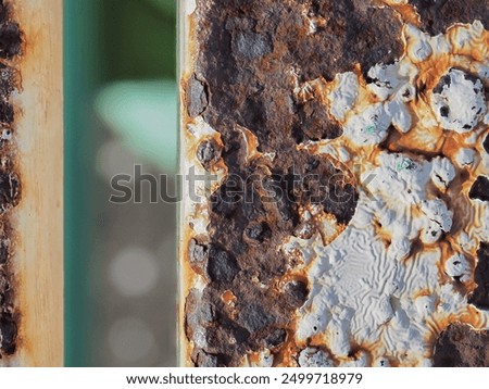 Similar – Image, Stock Photo The rust eats away at the metal plate towards the center. Nothing can stop it.