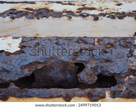 Similar – Image, Stock Photo The rust eats away at the metal plate towards the center. Nothing can stop it.