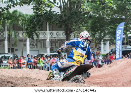 SURAT THANI THAILAND- Jul 20: The motorcross competition for charity and free fee to see .Among crowed of people to cheer up at BanhuoySork School on  Jul 20, 2014 in surat thani province,Thailand