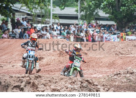 SURAT THANI THAILAND- Jul 20: The motorcross competition for charity and free fee to see .Among crowed of people to cheer up at BanhuoySork School on Jul 20, 2014 in surat thani province,Thailand