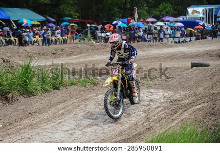 SURAT THANI THAILAND- Jun 19: The motorcross competition for charity and free fee to see .Among crowed of people to cheer up at changsaicity on Jun 19, 2011 in Surat thani province,Thailand
