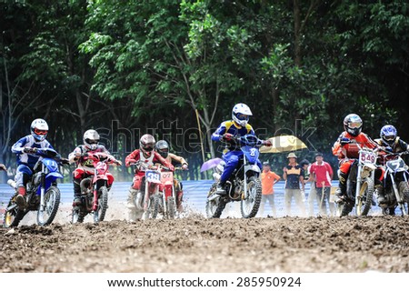 SURAT THANI THAILAND- Jun 19: The motorcross competition for charity and free fee to see .Among crowed of people to cheer up at changsaicity on Jun 19, 2011 in Surat thani province,Thailand