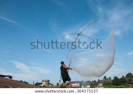 SURATTHANI THAILAND- Jul 26: Fishermen can fish along the banks all year long by using fishing gear at Punpin. July 26,2015 in surat thani province,Thailand