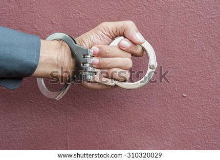 Demonstration held in handcuffs and shackles to take action against those who broke the law.