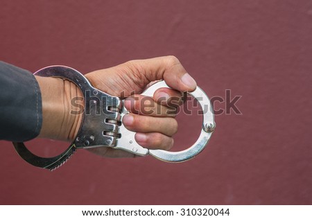 Demonstration held in handcuffs and shackles to take action against those who broke the law.
