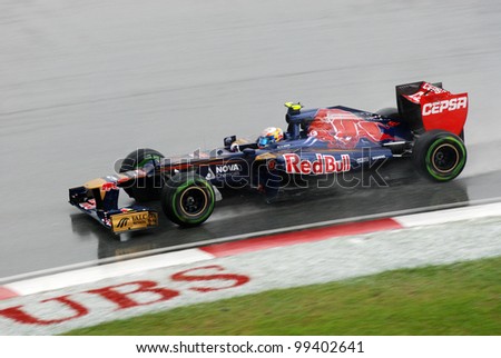 SEPANG, MALAYSIA-MARCH 25 : Toro Rosso Team driver Jean-Eric Vergne drive on wet track during race day of F1 Petronas Malaysian Grand Prix at Sepang F1 circuit on March 25, 2012 in Sepang, Malaysia