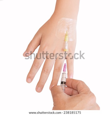 Doctor on call is injecting patient using a disposable plastic hypodermic syringe and catheter and needle