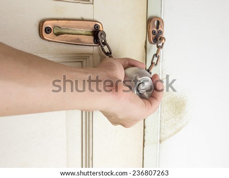 Man hand open old door knob